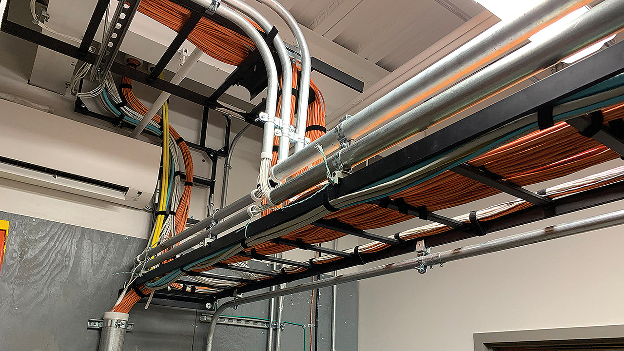 Ladder racking in a Telecom Room supports horizontal cable.