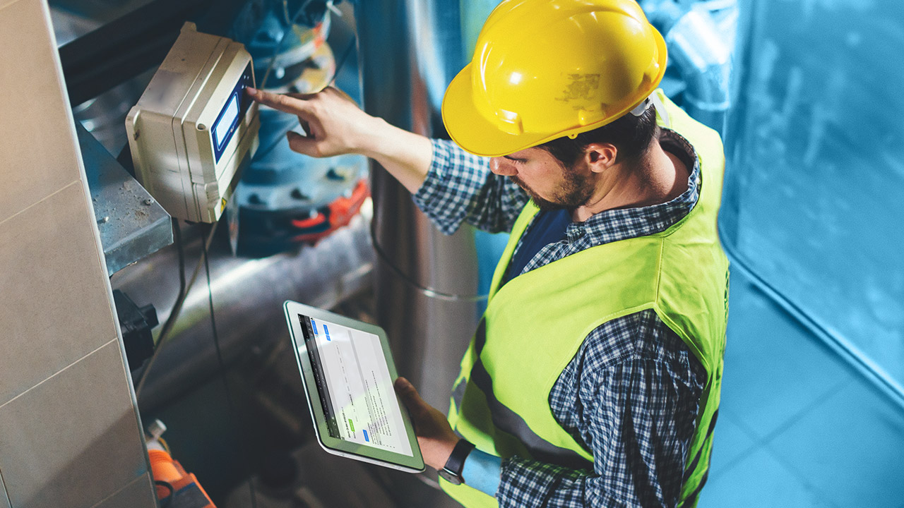 Man holding tablet completing Asset Survey