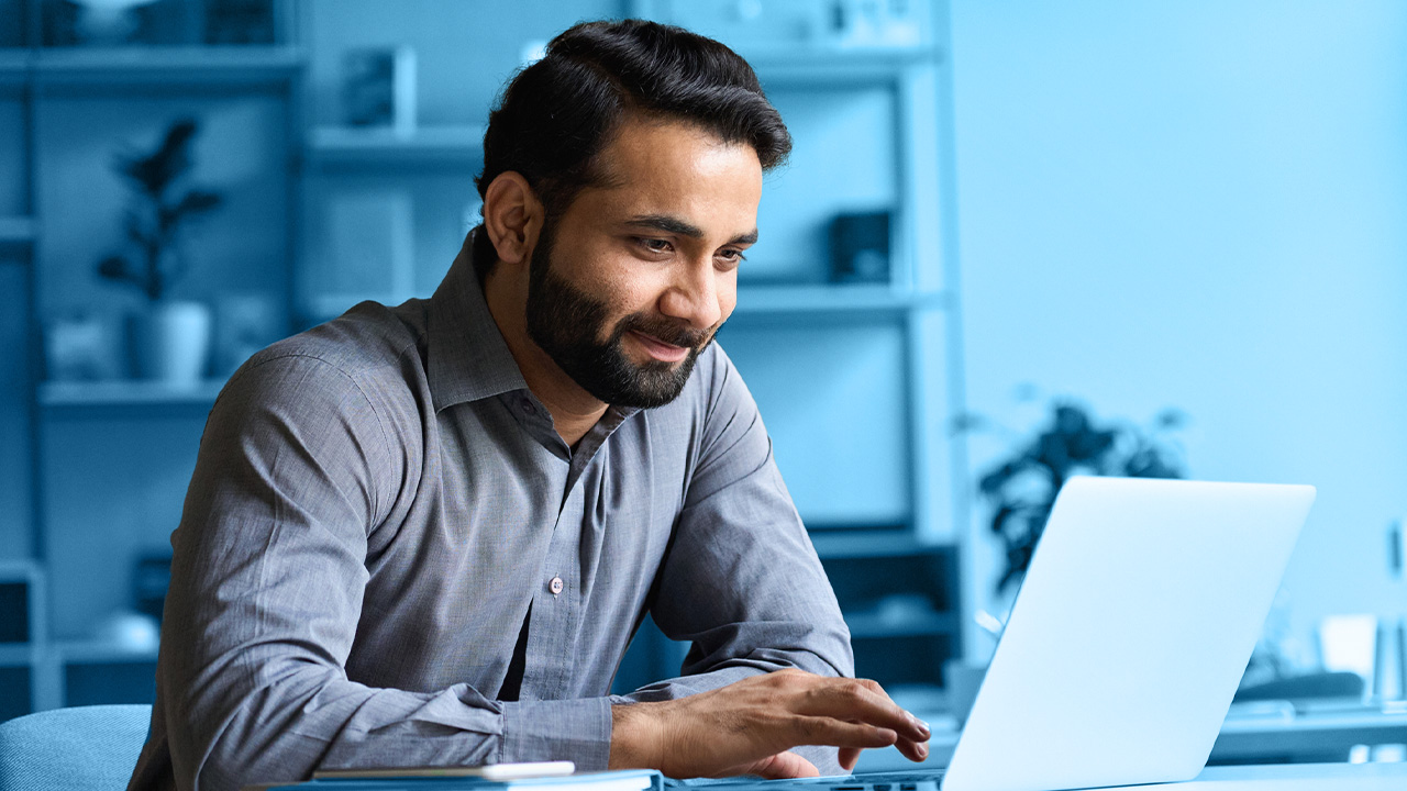 man working on laptop computer