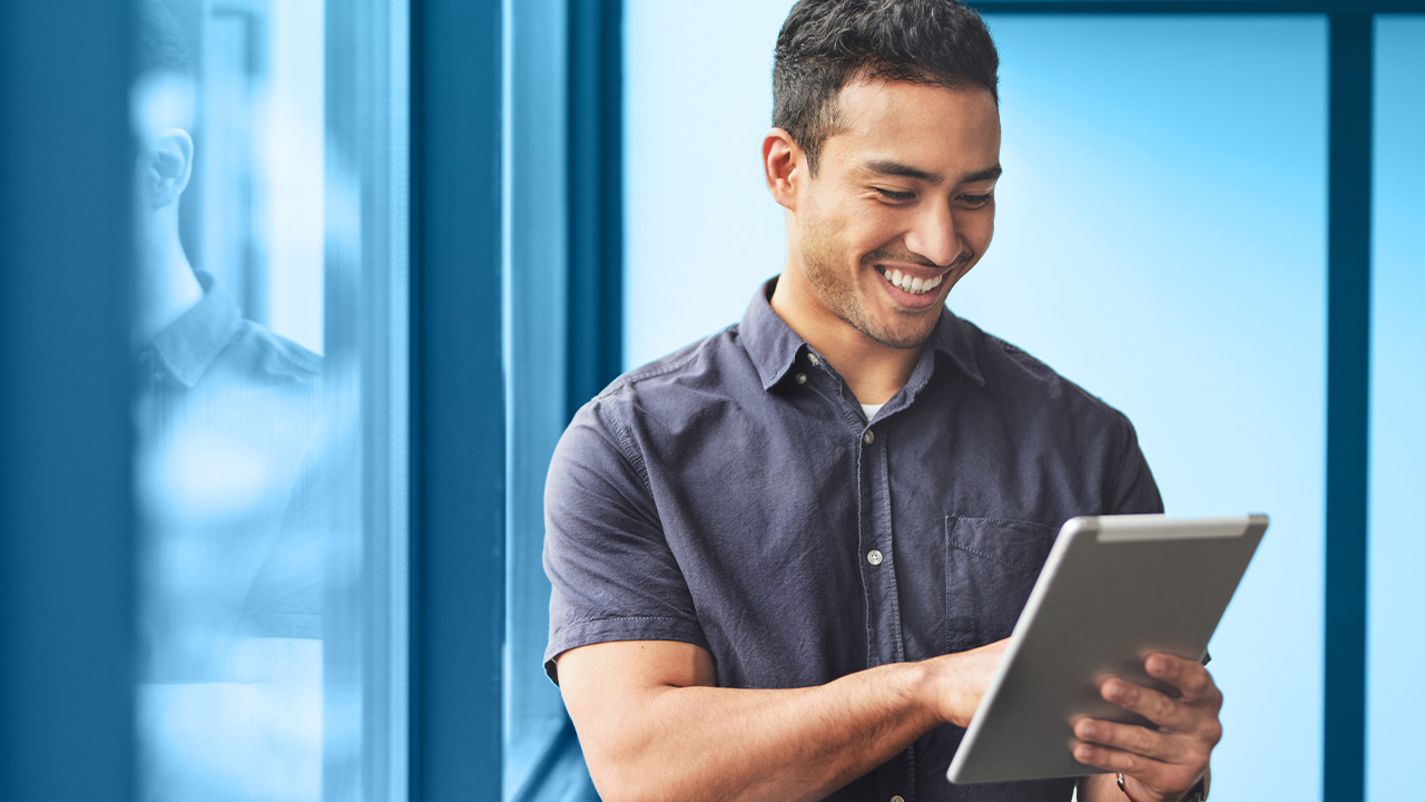 Man looking at tablet